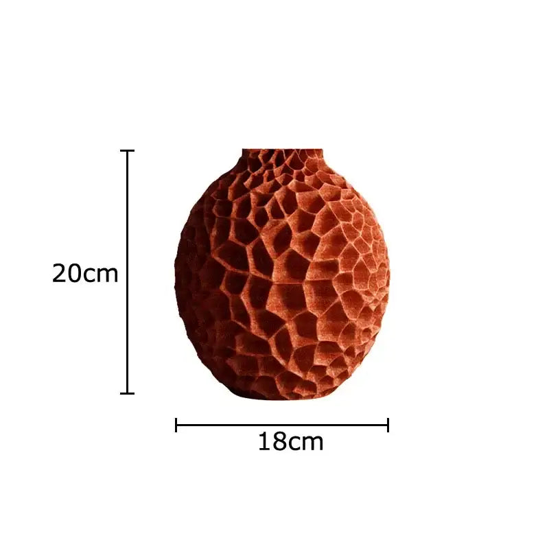 A terracotta ceramic vase with black honeycomb texture ideal for artificial flower arrangement in living room decor