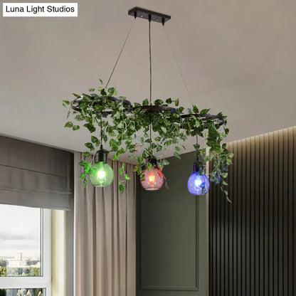 Black Iron Wheel 3-Head Pendant Light with Green Vine Detail and Globe Cage Design