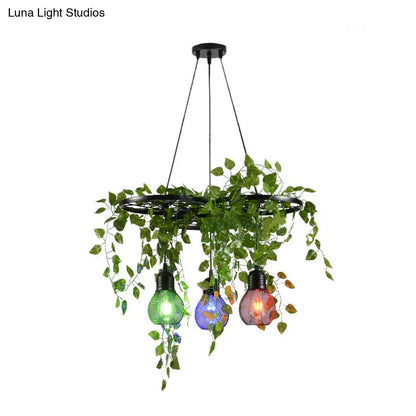 Black Iron Wheel 3-Head Pendant Light with Green Vine Detail and Globe Cage Design