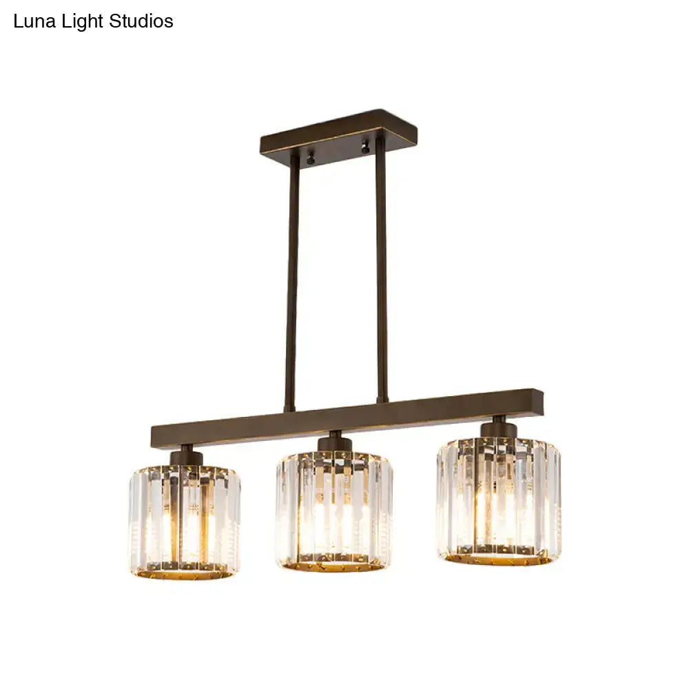 Decorbites black cylindrical island chandelier with bronze finish and clear crystal cylindrical shades for dining room