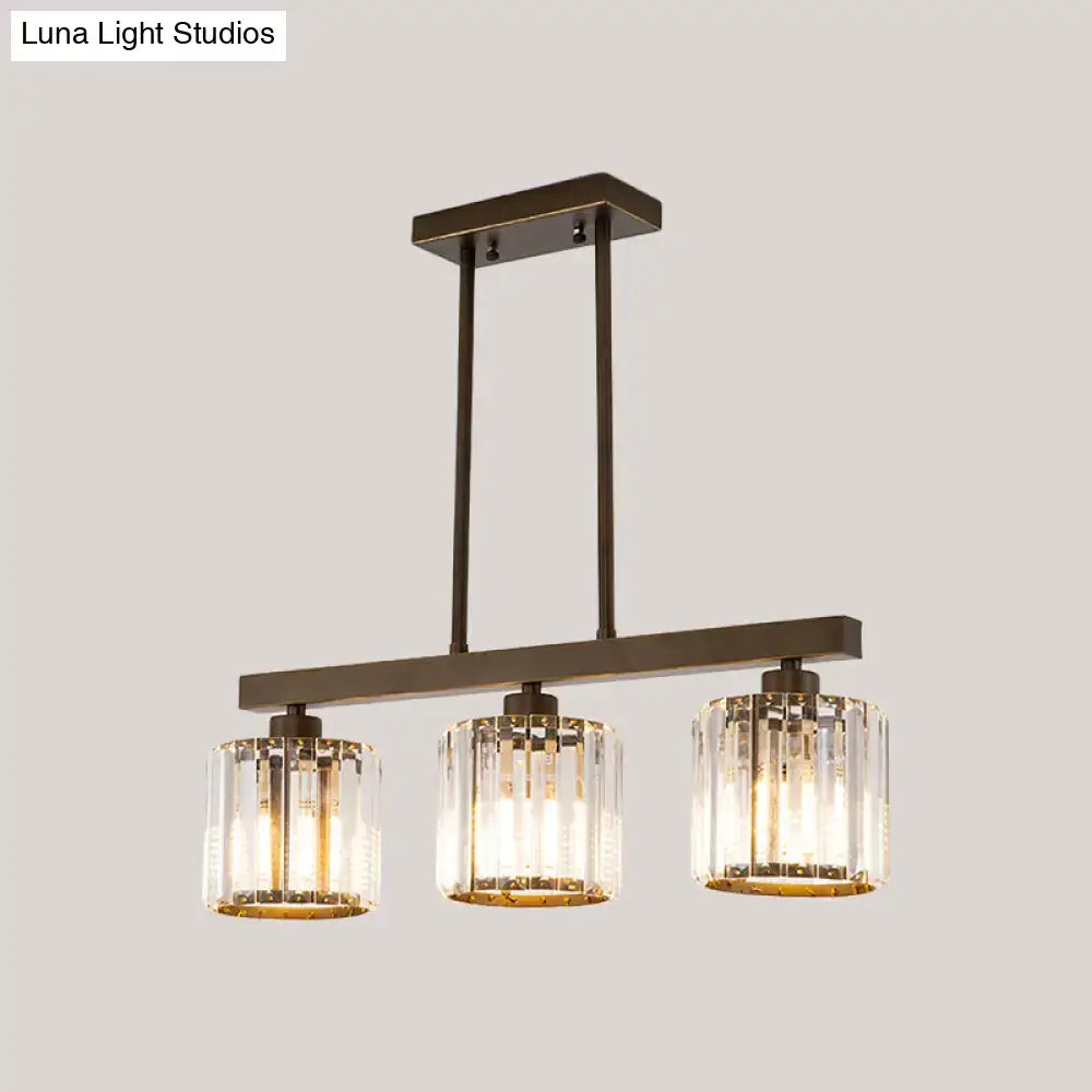 Modern bronze-finished decorbites cylindrical island chandelier with three clear crystal cylindrical shades for dining room