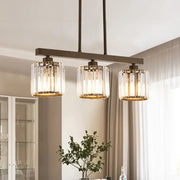DecorBites cylindrical island chandelier with clear crystal glass shades gold trim dark bronze frame for dining room