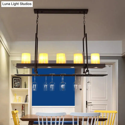 DecorBites black 5-light island light fixture with clear glass cylindrical shades and integrated wineglass hanging rack