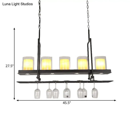 DecorBites black metal island light fixture with clear glass cylindrical pendants and five warm candle-style lights