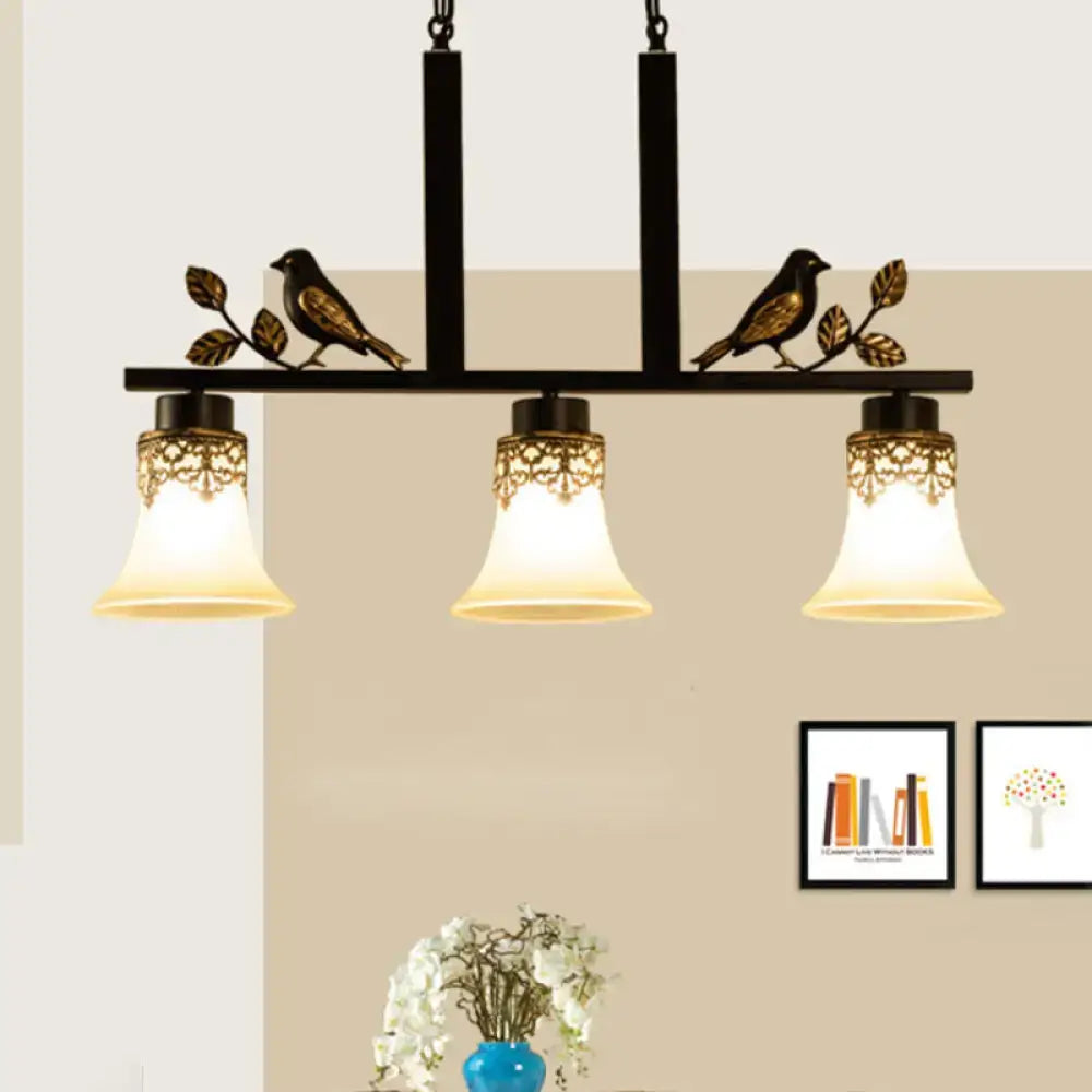 DecorBites black wrought iron light pendant with gold leaf and three tan glass shades for dining room island lighting