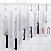 Set of black decorbites knife scabbard with five kitchen knives scissors and hooks hanging on black handles