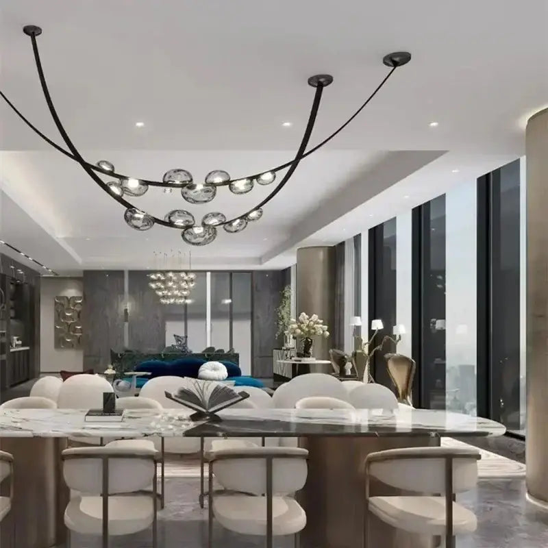 Modern black leather and glass pendant light with spherical light sources suspended in an elegant arc focal point