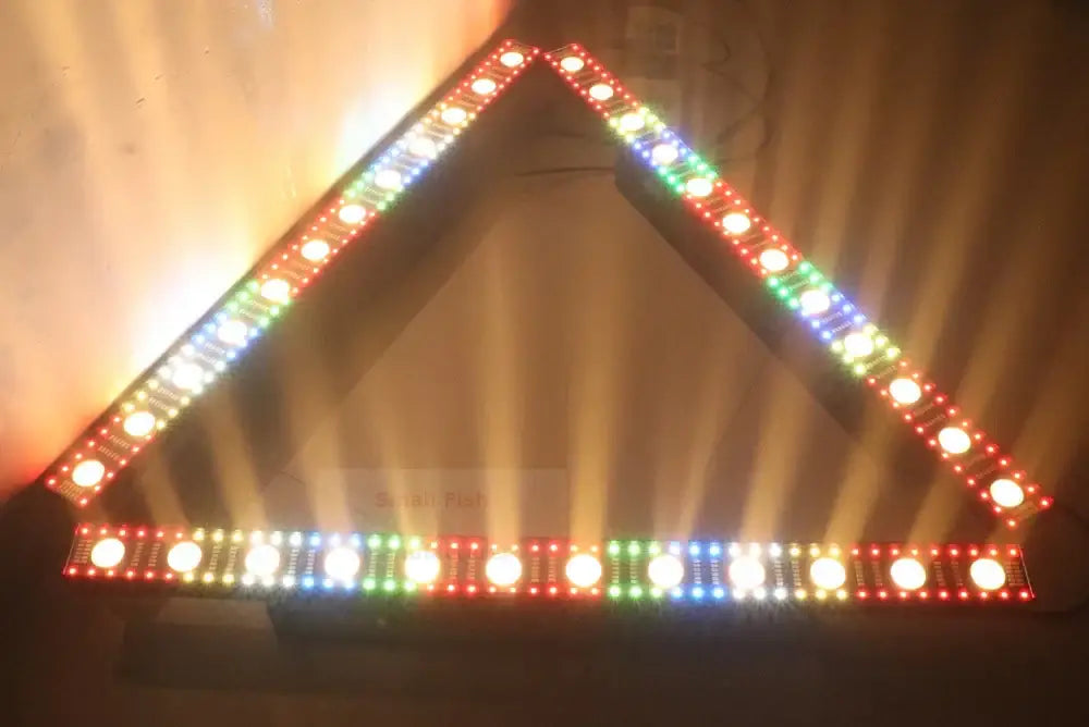 Black led wall wash bar light with a triangular multi-colored red green blue and white glowing border for dj strobe effect