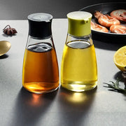 Black and lime green 170ml seasoning bottle set glass dispensers with amber and golden yellow liquids for soy sauce use