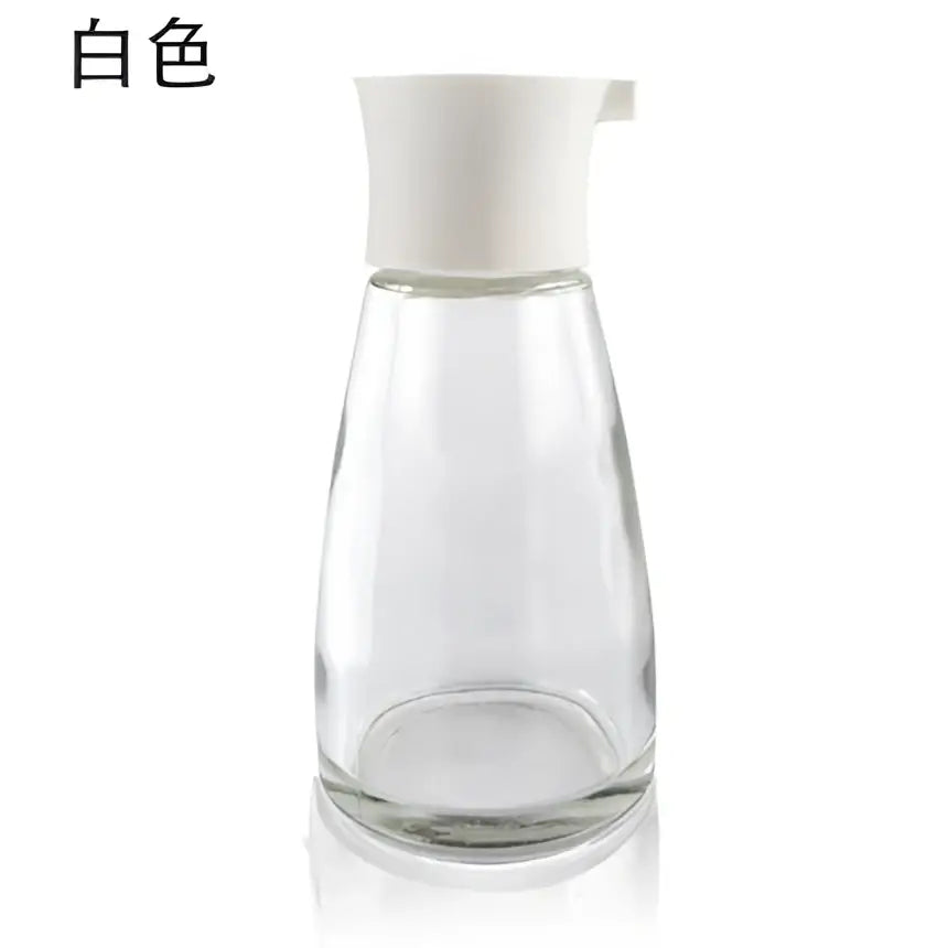 Clear glass 170ml seasoning bottle with white plastic spout and lid from black and lime green kitchen set