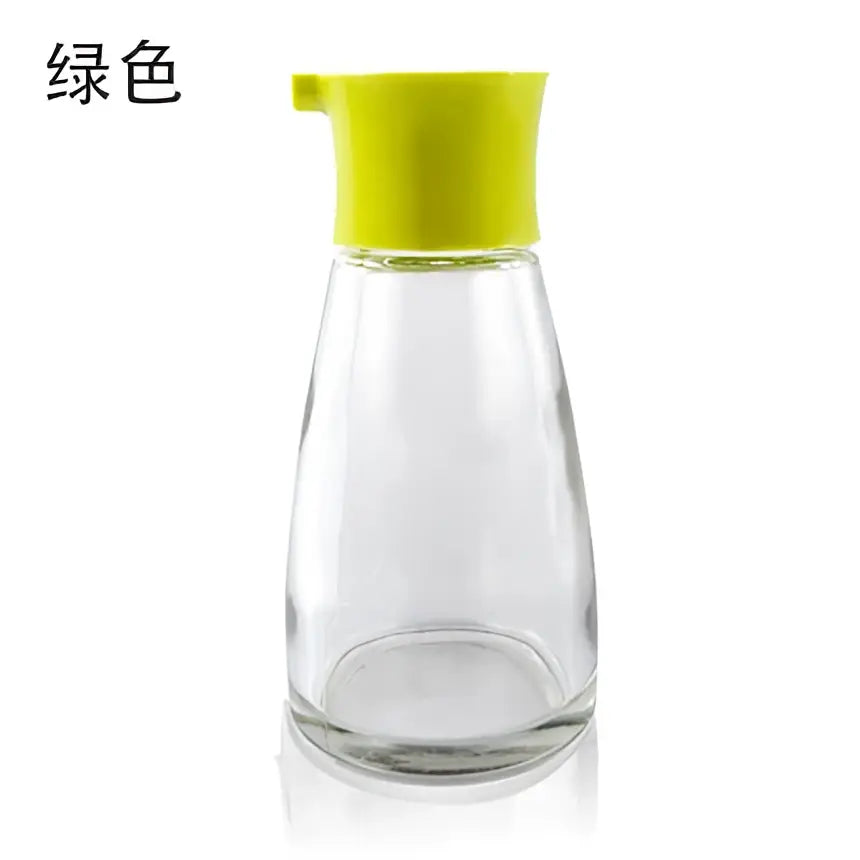 Clear glass 170ml seasoning bottle with bright lime green plastic spout lid for soy sauce or kitchen use
