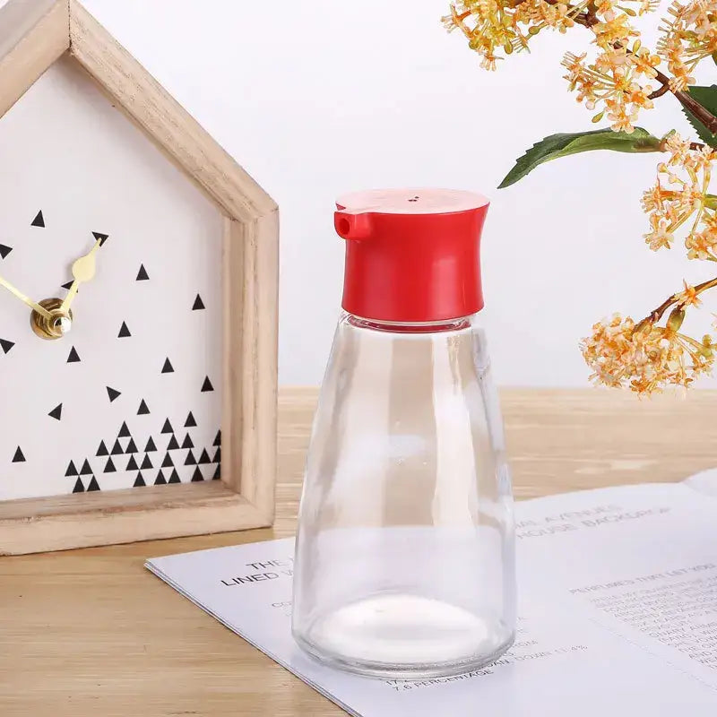 Clear glass 170ml seasoning bottle with bright red plastic pump dispenser cap from black and lime green set