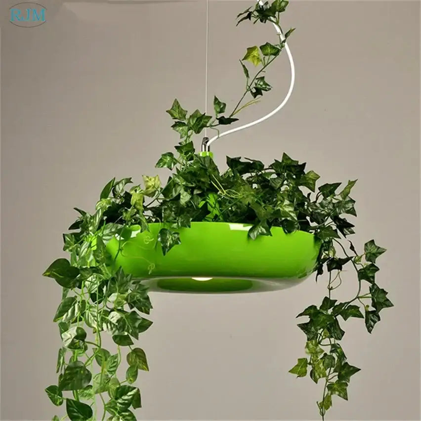 Vibrant green glossy hanging babylon garden pot with cascading ivy vines for pendant light kitchen decor