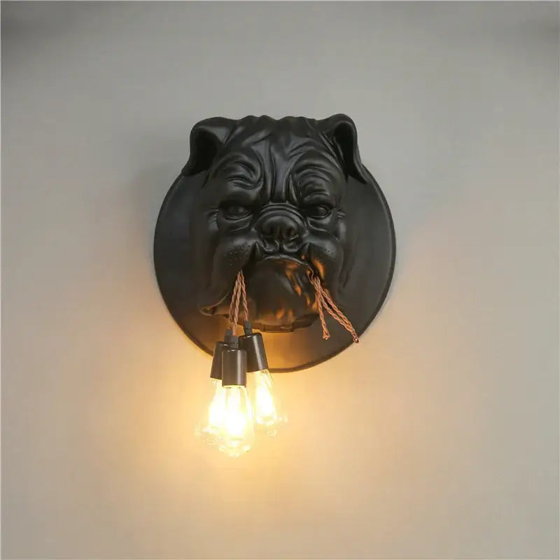 Black matte bulldog resin wall lamp with three exposed filament bulbs hanging from its mouth for living room decorbites bulldog resin wall
