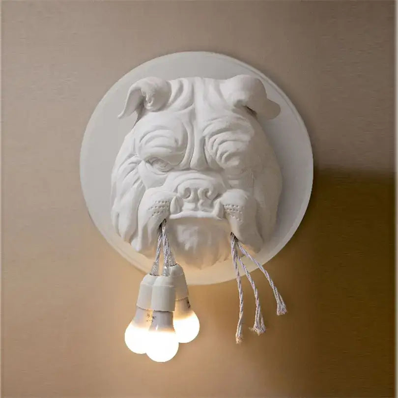 White sculpted bulldog resin wall lamp with three exposed bulbs hanging from mouth decorbites bulldog resin wall lamp