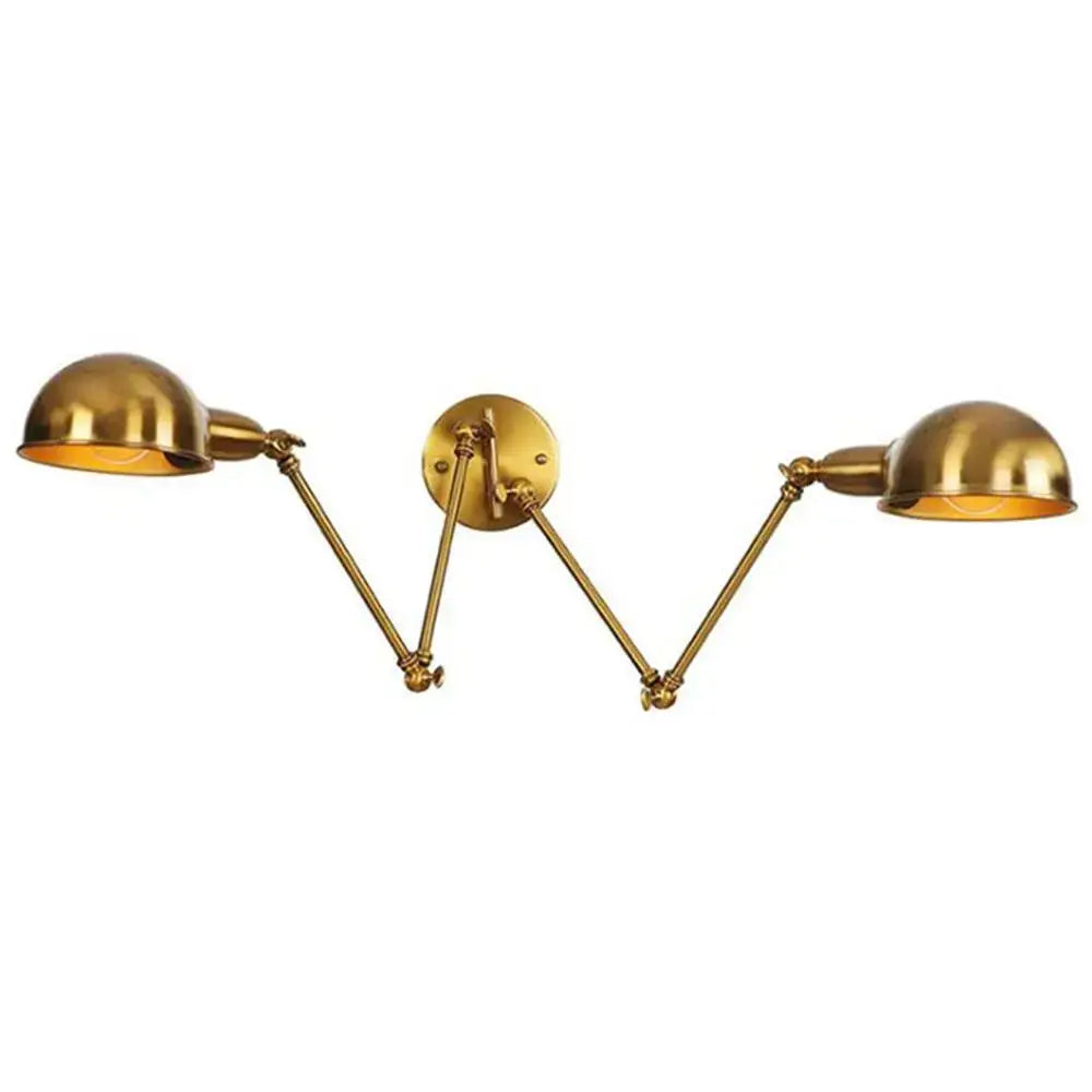 Brass double swing arm wall sconce with dome-shaped shades for bedroom reading light in satin finish