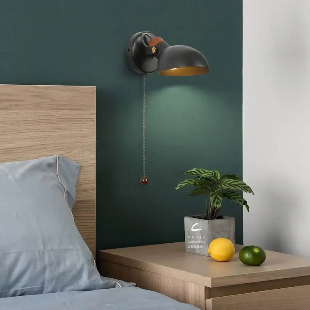 Black matte led wall sconce with brass accent and wood pull chain from decorbites led wall sconce collection
