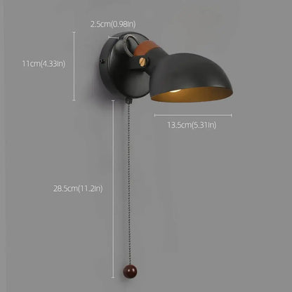 Black matte led wall sconce with gold interior wood pull chain and spherical end cap for bedroom decorbites led wall lighting