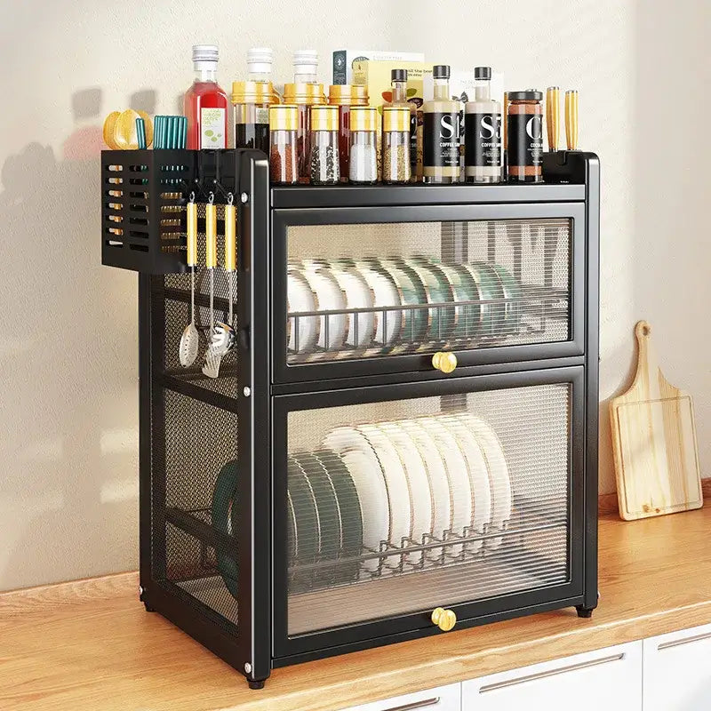 Black mesh double layer dish drying rack with drawers and top shelf holding spice jars and utensils for kitchen storage