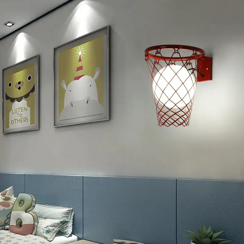 Black metal basketball wall lamp with red hoop, mesh net, and illuminated globe for bedroom wall lamp decorbites basketball wall