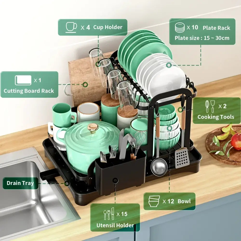 Black metal double layer dish drying rack with green and white ceramic plates mugs bowls and glassware neatly organized