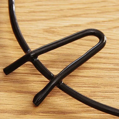 Black glossy metal wire pot holder with sleek curved design for decorbites gas stove burner rack use