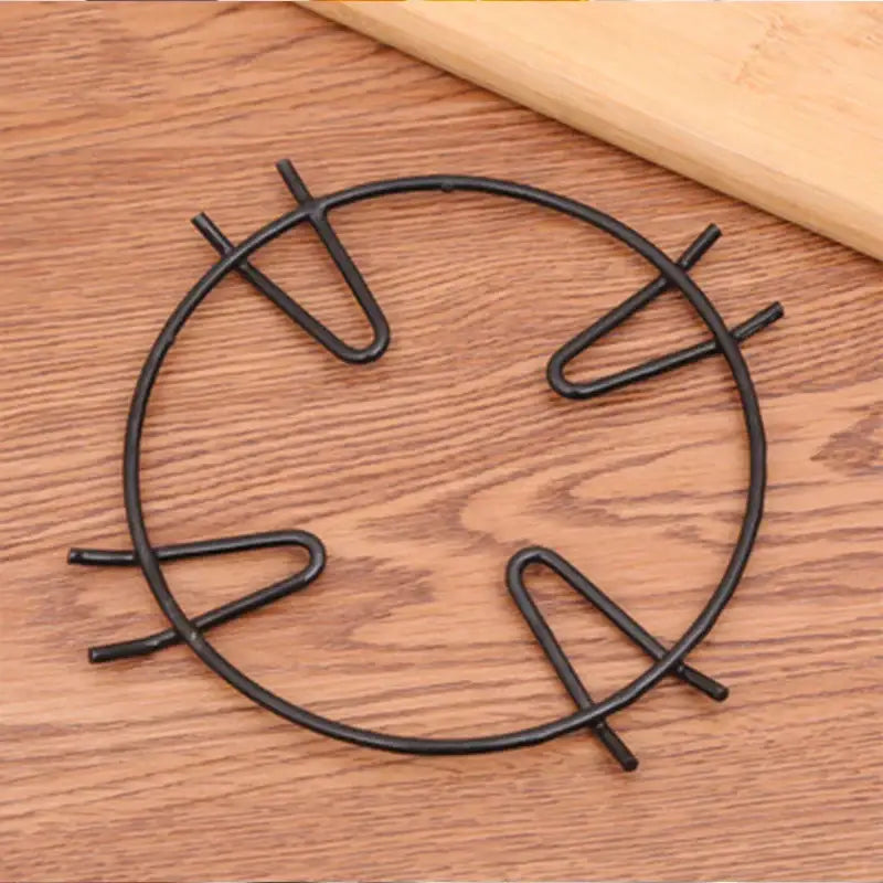 Black metal gas stove pot holder with four curved feet for decorbites gas stove and gas stove pot burner rack use