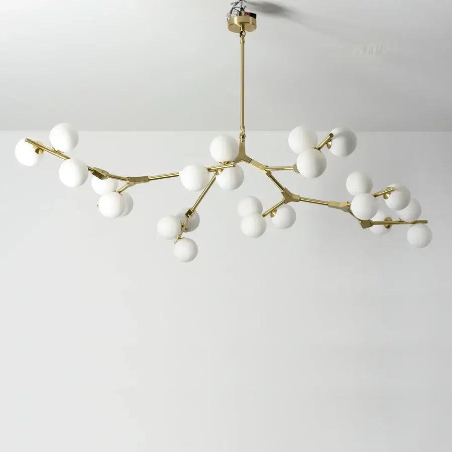Gold-toned branch-style black metal glass ball led chandelier with multiple white spherical globes for living room decorbites glass ball