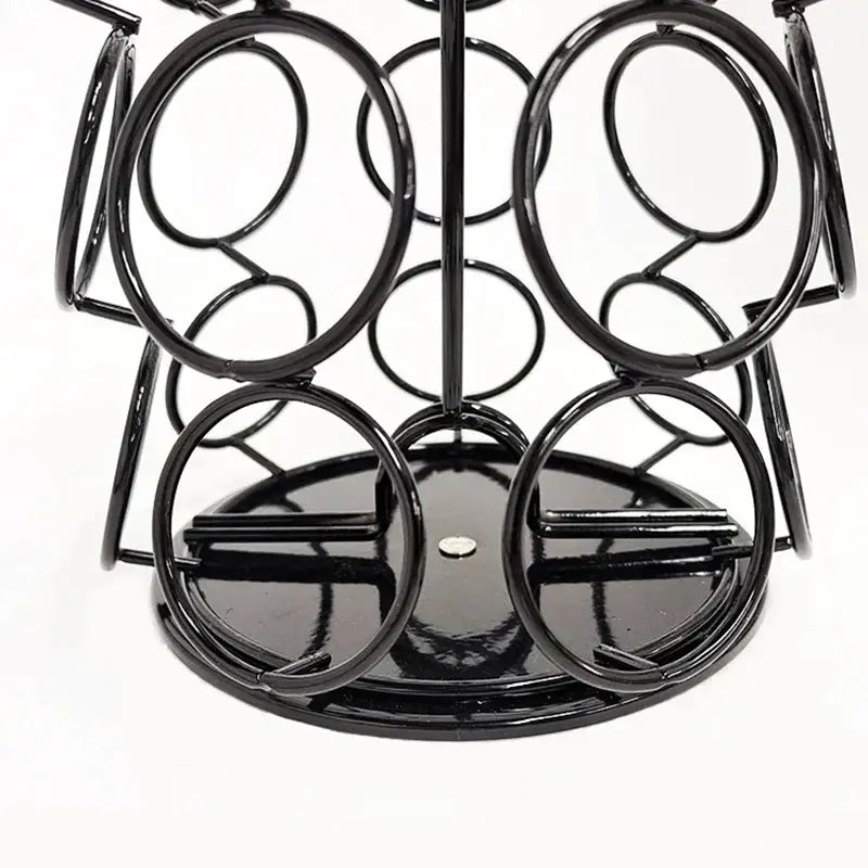 Black metal rotating dolce gusto storage rack with circular holders and glossy finish for kitchen capsules