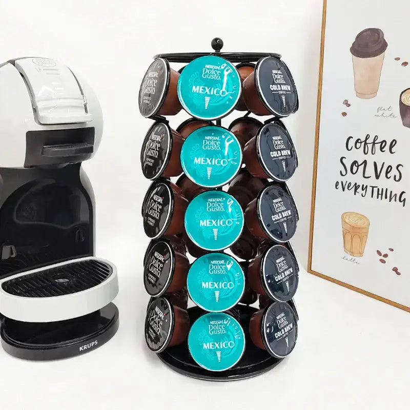 Black metal rotating storage rack holding teal and dark brown nestlé dolce gusto coffee capsules