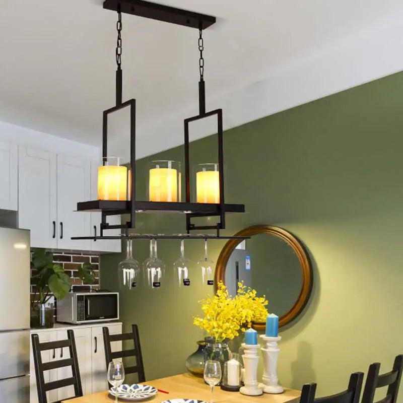 Black metal wine glass chandelier with three warm glass candle-style led lights and adjustable chain cord length for dining room