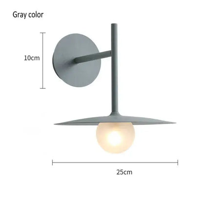 Black minimalist glass ball wall lamp with gray metal sconce and illuminated globe bulb for modern bedroom decorbites wall lamp