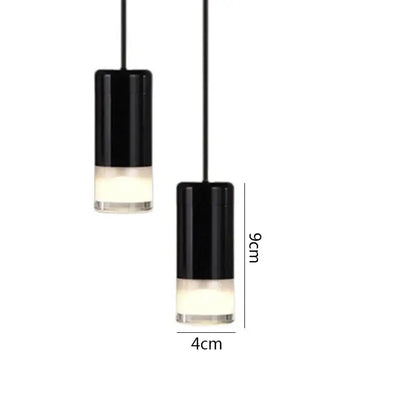 Black minimalist led wall lamp featuring black cylindrical pendant lights with frosted glass bases for bedroom decorbites
