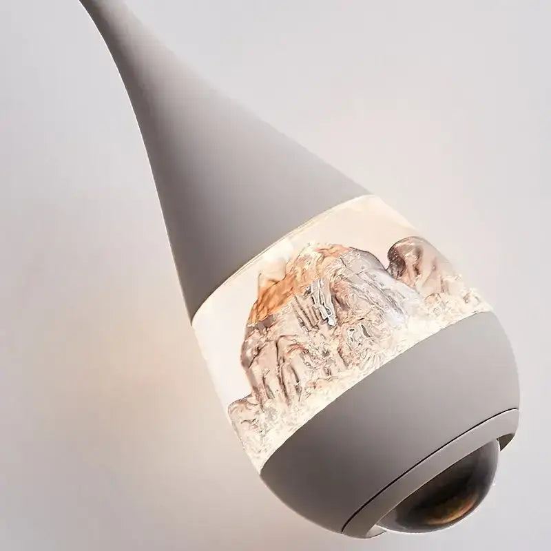 Gray teardrop-shaped glass pendant chandelier with textured mountain design for dining room decor lighting