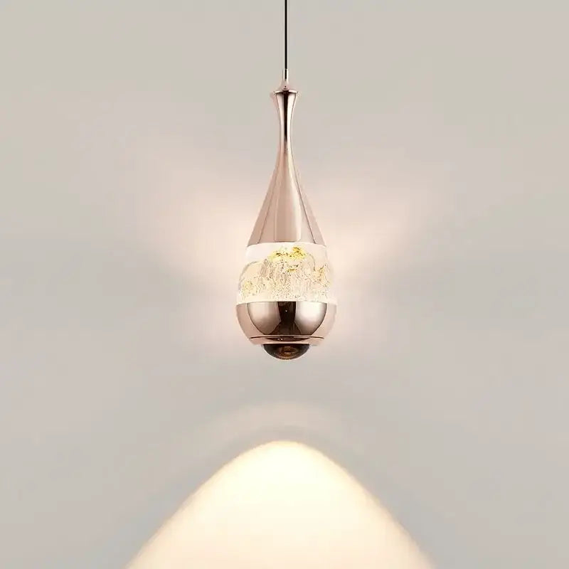 A sleek black mountain glass pendant chandelier with polished chrome and frosted glass for dining room decor