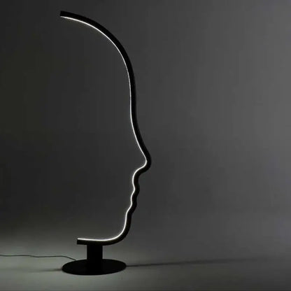 Black nordic human face floor lamp with illuminated outline shaped like a sleek black led decorbites floor lamp for living room
