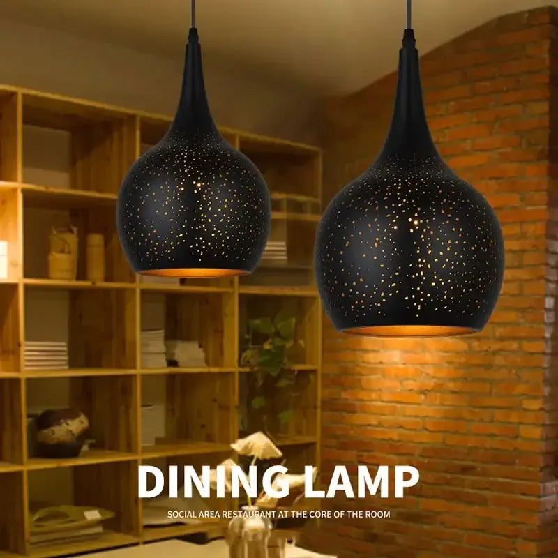 Black nordic industrial pendant light with speckled starry design and warm amber lighting for dining room decorbites pendant light