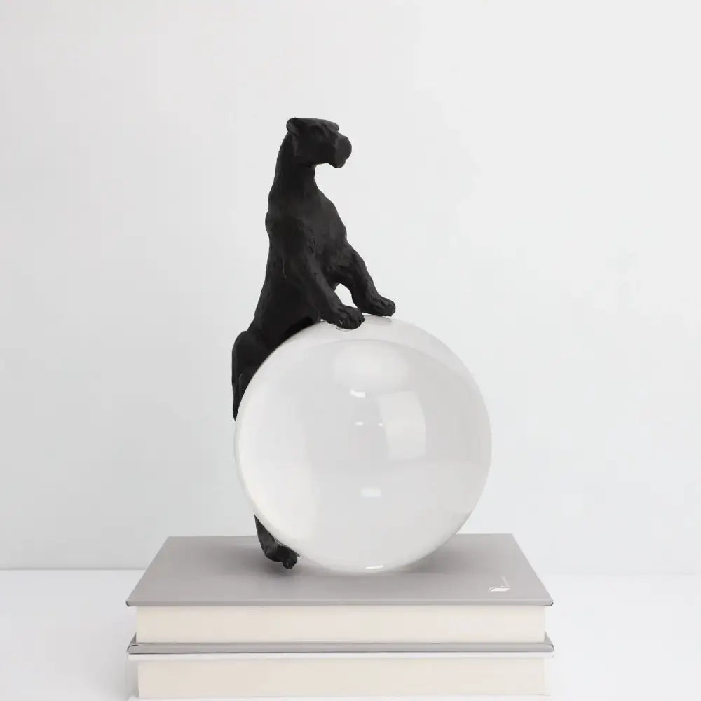 Black panther crystal ball metal animal sculpture perched on a translucent white sphere for living room decorbites decor