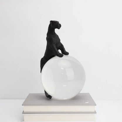 Black panther crystal ball metal animal sculpture perched on a translucent white sphere for living room decorbites decor