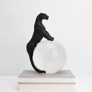 Black panther crystal ball metal animal sculpture standing atop a clear glass sphere for decorbites crystal ball decor
