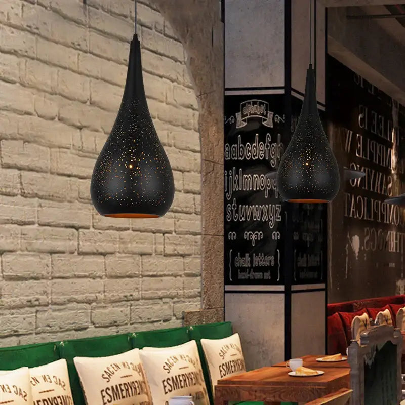 Black perforated iron hollow droplight pendant light with warm-toned interior for dining room decorbites iron hollow