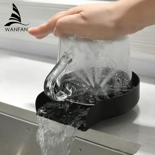Black plastic automatic glass rinser and cup washer with water flowing and a clear mug on top for home kitchen sink