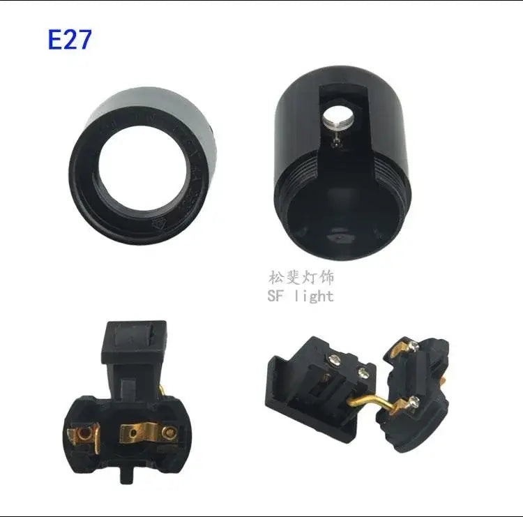 Black plastic e27 socket lamp base with switch featuring a matte finish and gold-colored metal contacts for bedroom use