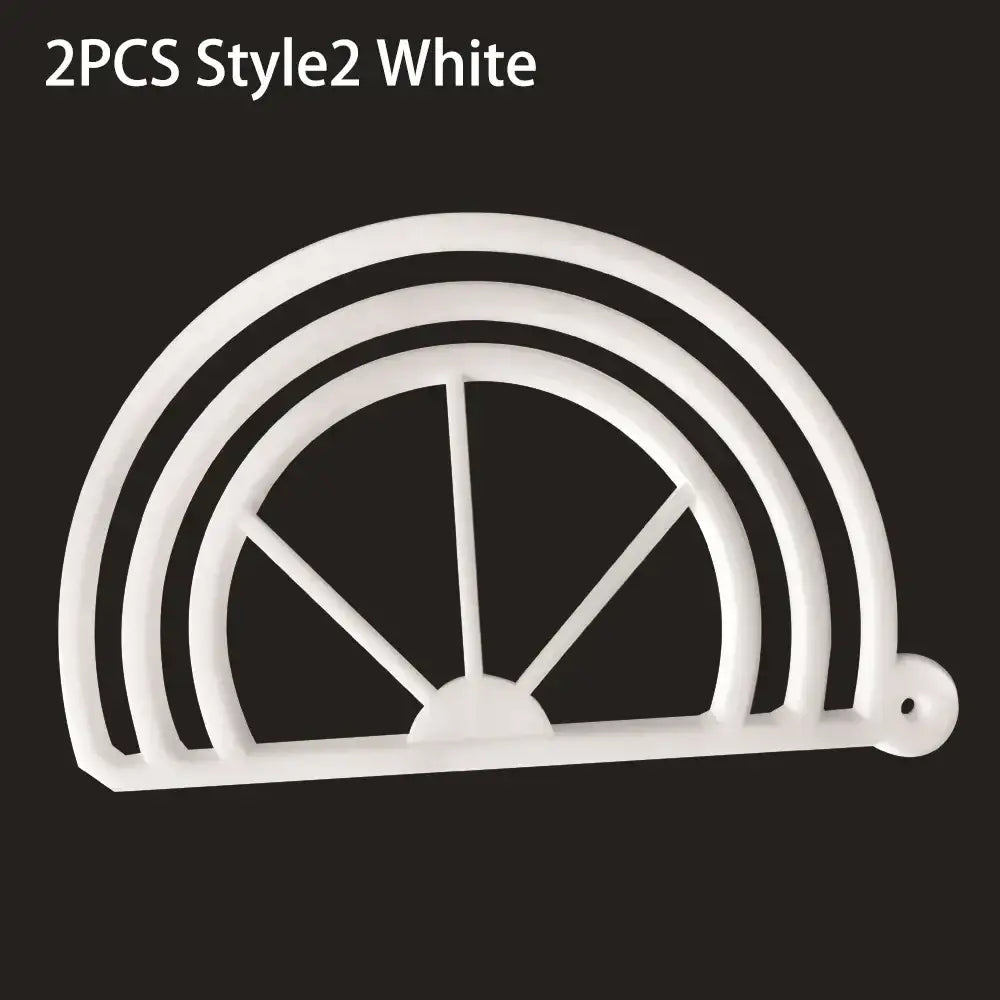 White plastic cookie cutter with concentric arches and spokes used as decorbites hat brim bender accessory