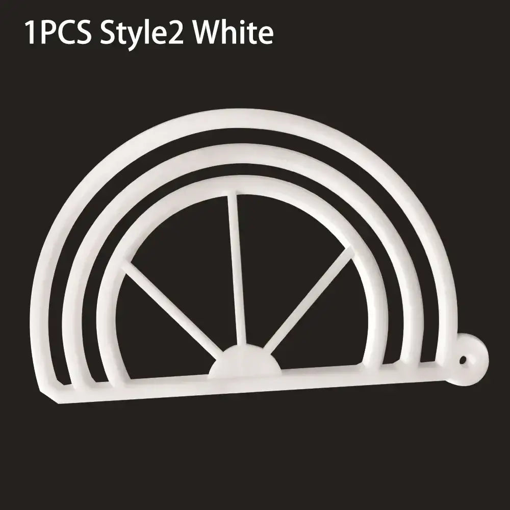 White plastic half-circle cookie cutter with concentric arches and spokes and hole for decorbites hat brim bender