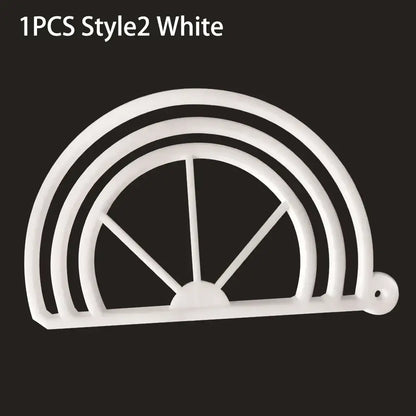 White plastic half-circle cookie cutter with concentric arches and spokes and hole for decorbites hat brim bender