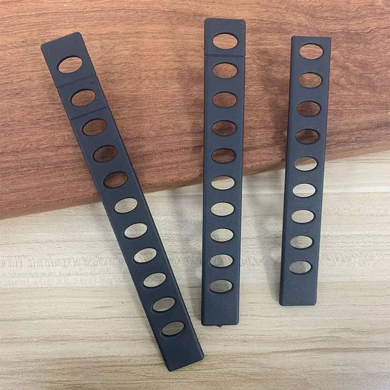 Black plastic knife blade protectors set with three rack dividers featuring evenly spaced oval cutouts for decorbites knife blade protection