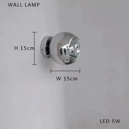 A sleek spherical chrome wall lamp with led 5w bulb complements decorbites black postmodern bubble glass chandelier