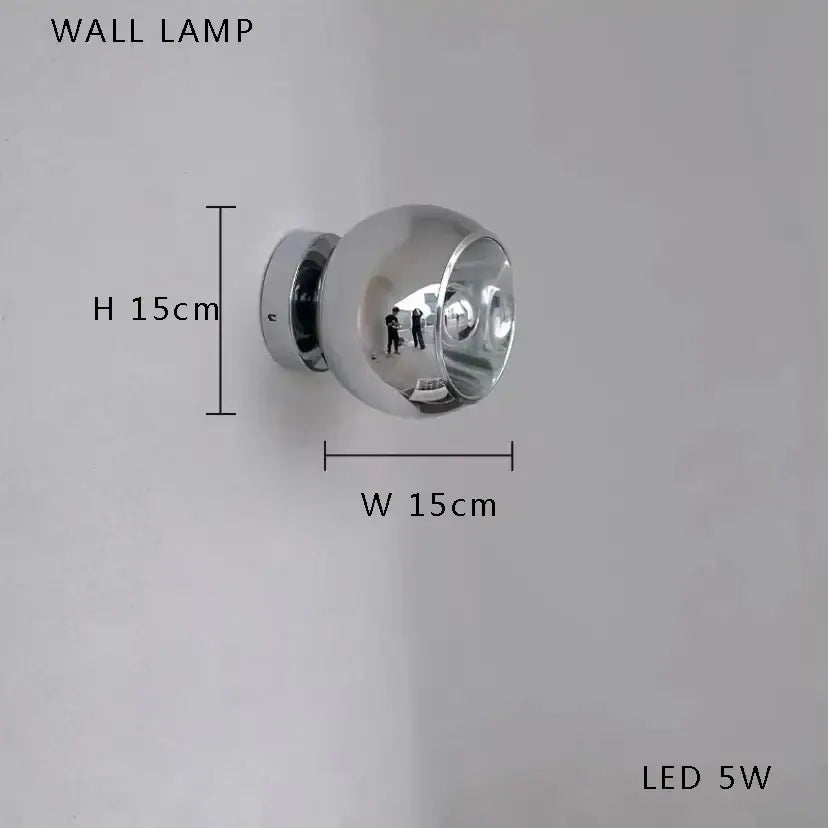 A sleek spherical chrome wall lamp with led 5w bulb complements decorbites black postmodern bubble glass chandelier