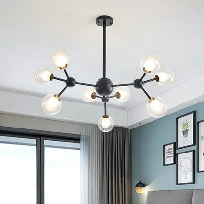 Black postmodern sputnik chandelier with clear glass globes and brass accents for dining room decorbites black postmodern